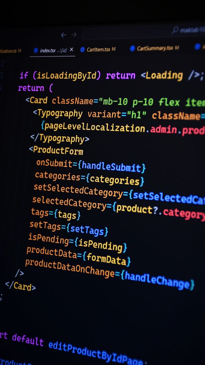 gallery-4 Close-up of JSX code on a monitor, showcasing colorful syntax used in ReactJS development.